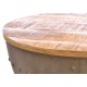 Round metal coffee table with a removable solid mango wood top in a rustic finish