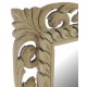 Ornately carved solid wood framed mirror with a stripped back old world finish