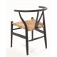 Solid wood chair with a rush seat and a plain wood finish designed in an curved wishbone style